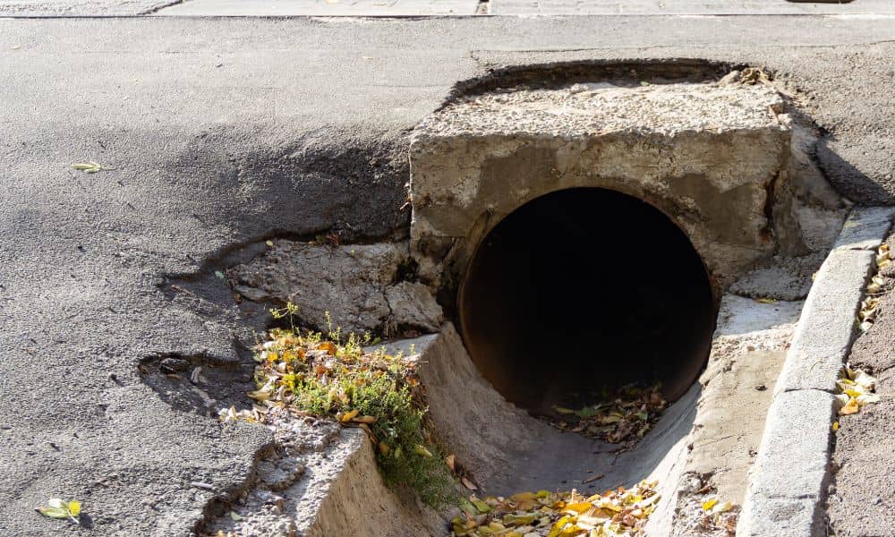 Street curb and gutter stormwater drainage inlet handling roadway runoff